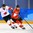 GANGNEUNG, SOUTH KOREA - FEBRUARY 15: Switzerland's Andres Ambuhl #10 pulls the puck away from Canada's Chris Kelly #11 during preliminary round action at the PyeongChang 2018 Olympic Winter Games. (Photo by Matt Zambonin/HHOF-IIHF Images)

